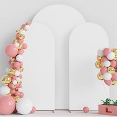 the balloon arch is decorated with gold, white and pink balloons