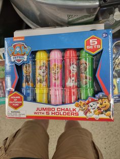 a person holding up a box of paw patrol jumbo chalks with 5 holders