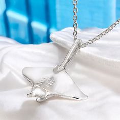 • BEST STINGRAY GIFT FOR OCEAN LOVERS- Beauty and grace captured in a magical moment. Sculpted from Roland's own personal footage captures all the graceful movement of this majestic manta ray. This ocean inspired pendant is a natural conversation piece. This stunning manta design is an original unique stingray gift idea. This beautifully crafted realistic style is perfect for any sea life ocean lover. Look no further, we have the perfect gift for you or your favorite scuba diving friend •PRIDE IN OUR PRODUCTS- This stingray gift for her includes a premium sterling silver cable chain in your choice of 16" or 18" length. Our chain has a solid sterling, high quality, lobster claw style clasp. See our sizing chart for proper fit. Our lead and nickel free jewelry is also hypoallergenic. Engrave Silver Adjustable Necklaces For Gifts, Adjustable Silver Necklaces For Gift, Gray Pendant Jewelry For Gifts, Gray Pendant Necklace Gift, Gray Pendant Jewelry As A Gift, Gray Sterling Silver Necklace For Gift, Gray Sterling Silver Necklace Gift, Adjustable Silver Charm Necklace Gift, Gift Ide