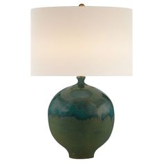 a green lamp with a white shade on it's base and a light in the shape of a vase