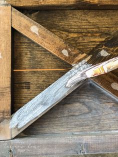 a close up of a piece of wood that has been stained white and is being used as a frame