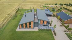 an aerial view of a house in the middle of a field