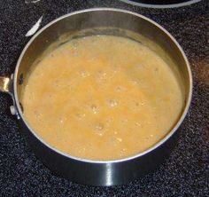 there is a pot on the stove with some food in it that is ready to be cooked