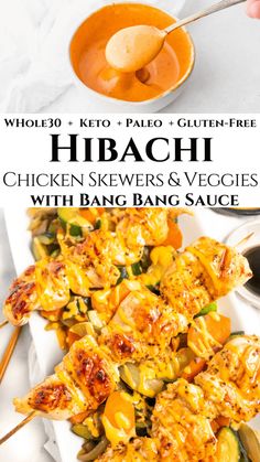 chicken skewers and veggies with bang bang sauce on a white plate