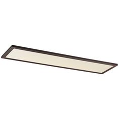 a rectangular light fixture mounted on the wall above a white surface with a brown finish