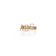 Whether you choose an initial just for her or multiple initials to represent family and children, these delicate rings can be worn alone or stacked together. Made from 14kt yellow gold, each ring is handcrafted in NYC by renowned jewelry designer, Sarah Chloe.    Available in ring size 6 or 7  Initial: 0.3" h  14kt yellow gold and optional  See Product Information for more details.  Imported  Monogramming is foil debossed. Layered Initial Necklace, Chloe Jewelry, 14kt Gold Jewelry, Heart Rings, Mom Ring, Baguette Diamond Rings, Necklace Layered, Family Necklace, Personalized Ring