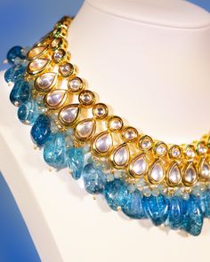 Sharawar Clear Blue Quartz Necklace Blue Fusion Jewelry With Intricate Design, Blue Fusion Style Tilla Jewelry, Blue Tilla Fusion Jewelry, Blue Fusion Tilla Jewelry, Fusion Style Blue Necklace For Festive Occasions, Blue Pendant Necklace For Festivals, Turquoise Kundan Necklace With Meenakari Detailing, Blue Temple Jewelry Necklaces For Festivals, Elegant Turquoise Kundan Necklace For Festive Occasions