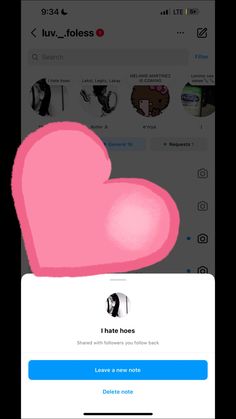 an iphone screen with a pink heart on it