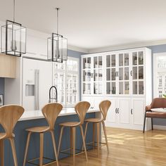 an image of a kitchen setting with bar stools and chairs in the center island