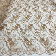 Dress up your special occasion with Lace USA's Beaded Lace Fabric Embroidered on 100% Polyester Net Mesh. This high-end, elegant fabric is perfect for making timeless beautiful couture lace pieces. Create a one-of-a-kind bridal lace, evening dress lace, quinceanera dress lace, or dance costume lace with decorative lace, beaded lace, and embellished lace crafted from this luxurious fabric. Showcase your creativity with our wedding dress lace and formal dress lace to make a statement that will las