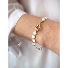 "Delicate mother of pearl bracelet with 14kt gold filled beads and a toggle clasp Individually selected high quality mother of pearl beads make the bracelet truly special and one of a kind. The delicate and minimalist design goes well with both casual and sophisticated looks. Size of the mother of pearl pearl beads\" 6mm Size of the 14kt gold filled beads: 2mm Size of the 14kt gold filled toggle clasp: 12mm Follow us on INSTAGRAM: @soelle_jewelry Tag us on social media: #soelle_jewelry Packed wi Wedding Pearl Bracelet, Elle Jewelry, Mother Of Pearl Bracelet, Pearl Bracelet Wedding, Valentines Bracelets, Silk Bracelet, Pearl Jewelry Wedding, Bracelet Pearl, Pearl Heart