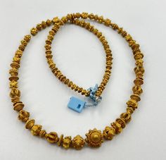 A Nice Collection Probably Ancient Burmese Pyu Or Pagan Dynasties Solid Gold Jewelry Necklace Beads Lot. Gold Purity 17k To 18k. Gold Test Certificate Available On Request From Customer. Total Weight 49.6 grams. Size Details Pictures Are Listed. Conditions Of Gold Beads As Shown In The Pictures. We Provide Free Shipping Service .We Ship Mostly Via FedEx, UPS And DHL Etc.    If You Have Any Questions Please Feel Free To Send Us Message. Traditional Single Strand Wedding Necklace, Yellow Gold Beaded Necklace For Wedding, Wedding Yellow Gold Beaded Necklaces, Yellow Gold Beaded Necklaces For Wedding With Polished Beads, Yellow Gold Temple Necklace With Gold Beads, Gold Beaded Temple Necklace For Festivals, Traditional Hand-strung Gold Necklaces, Traditional Gold Single Strand Jewelry, Yellow Gold Temple Necklace With Round Beads For Wedding