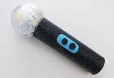 a black and blue toothbrush wrapped in foil