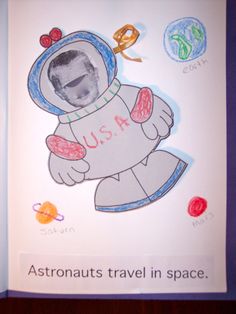 an open children's book with pictures of astronauts