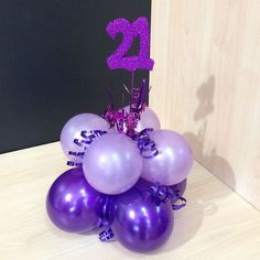 purple balloons with the number twenty two on them