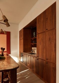 the kitchen is clean and ready to be used as a dining room or office space