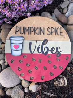 a wooden sign that says pumpkin spice vibes with a cup of coffee on it