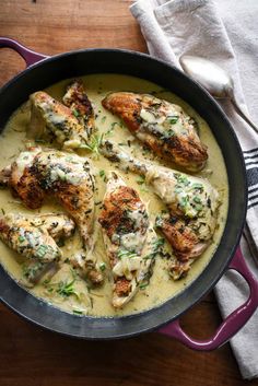 chicken in a creamy sauce with herbs on top