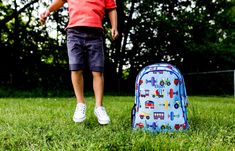 This school backpack will make your child's school-time more fun! The durable exterior can stand up to just about anything - even homework. And the roomy interior helps keep school work organized. The Trains, Planes, & Trucks pattern makes creative use of bold primary colors. The design's eclectic group of vehicles stand out delightfully from the cool blue background. Measures 15 in. x 11 in. x 7 in. Extra-durable 600-denier polyester fabric Recommended for ages 3-10 years Two padded adjustable straps Padded back for extra comfort Two zippered compartments Side mesh water bottle pocket Interior moisture-resistant nylon lining Adjustable padded straps Interior utility pockets and pencil holder Embroidery friendly Olive Kids, Wildkin View All Accessories In This Collection Cool Blue Background, School Work Organization, Boys Room Mural, Boy Room Wall Decor, School Backpack Boys, Blue Train, Air Planes, Quilted Duvet Cover, Boys Backpacks