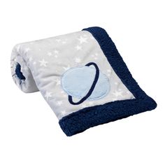 a blue and white blanket with an astronaut design on it