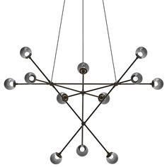 a chandelier with eight balls hanging from it's center and four arms