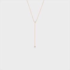 This dainty and sophisticated piece is the perfect addition to any collection! 14k Gold Lariat Diamond Necklace Gift, Minimalist Long Drop Diamond Jewelry, Elegant 14k Gold Diamond Necklace With Teardrop Pendant, Delicate White Gold Lariat Necklace With Adjustable Chain, Dainty White Gold Lariat Necklace With Delicate Chain, Minimalist White Gold Lariat Necklace With Delicate Chain, 14k Gold Drop Necklace Fine Jewelry, 14k White Gold Lariat Necklace With Adjustable Chain, Elegant 14k Gold Lariat Diamond Necklace