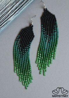 Green seed bead earrings Shiny green beaded earrings Evening | Etsy Elegant Green Chandelier Earrings With Colorful Beads, Elegant Green Beaded Chandelier Earrings, Elegant Green Beaded Fringe Earrings, Green Beaded Dangle Chandelier Earrings, Green Beaded Fringe Chandelier Earrings, Elegant Green Tassel Earrings With Round Beads, Elegant Green Beaded Tassel Earrings, Green Beaded Tassel Earrings With Round Beads, Green Beaded Earrings With Black Beads For Gift