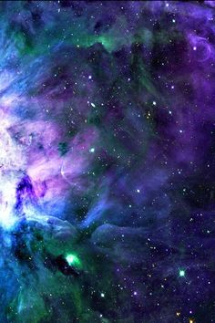 an image of the galactic sky with stars and clouds in purple, blue and green colors