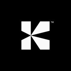 the letter k is made up of white squares on a black background, and it appears to be an abstract shape