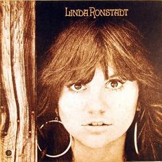 the album cover for linda ronstendt's new album, in which she is wearing large hoop earrings