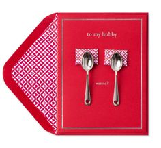 two silver spoons are sitting on a red card with the words, to my hubby