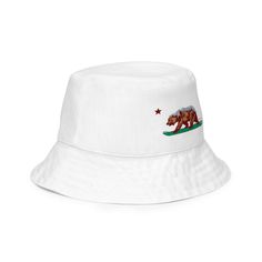 Goldie the Cali Grizzly on his board in this white bucket hat. California bucket hat. CA reversible bucket hat. Made of super breathable premium fabric, this comfy hat will become your go-to streetwear accessory. • 100% polyester • Moisture-wicking and breathable fabric • Linen feel material • Reversible • Available in 2 sizes White Bucket Hat, Reversible Bucket Hat, Streetwear Accessories, Cali, Breathable Fabric, Moisture Wicking, Bucket Hat, California, Street Wear