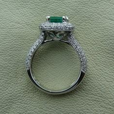 "The center is a natural Emerald weight is 1.01cts. With 164 pave set diamonds approximately 1 cts TCW . It is made in 18k natural white gold. The ring size is 4.5 We can make it any size from 4.5 to 5 and you still be able to return it within the listed time frame. We love this ring because it represents the way jewelry should be made with craftsmanship and quality. This ring is anything but ordinary. Our pieces are designed and made with craftsmanship and sustainability in mind, our designs ar Antique Engagement Rings Vintage, Engagement Rings Vintage Halo, Engagement Ring Vintage, Emerald Engagement, Emerald Engagement Ring, Halo Diamond Engagement Ring, Halo Engagement Ring, Natural Emerald, Halo Engagement