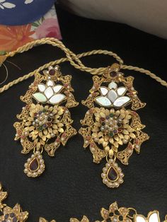 A luxurious spin on traditional jewelry design! Crafted to blend in every celebratory occasion! Meet the perfect festive set for the upcoming wedding season. Beautiful and hand crafted bridal set is embellished with multi stones and multicolored beads in gold polish. Set included: necklace, earrings, Make to order and shipping time 4-6 weeks. Hand crafted and gold plated kundan indian/pakistani jewelry Material:brass,stone,gemstone,pearl We bring you casual as well as party wear jewelry which co Ceremonial Kundan Bridal Earrings In Temple Style, 22k Gold Bridal Chandbali Necklace With Stone Work, Ceremonial Kundan Bridal Earrings With Intricate Design, Bollywood Kundan Bridal Sets With Intricate Design, Temple Jewelry Stone Work Danglers For Wedding, Bollywood Style 22k Gold Kundan Necklace For Wedding, Multicolor Chandbalis With Intricate Design For Weddings, Multicolor 22k Gold Bridal Necklace For Wedding, Ceremonial Kundan Bridal Earrings With Stone Work