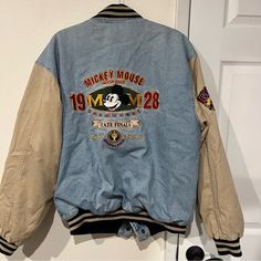 - Vintage Authentic Original Mickey Mouse 1928 Men’s Denim Varsity Jacket - Size: L - Rare Find In Near Perfect Condition - Disney Bomber Jacket Snaps Up Front - Front Slash Pockets - Inside Pocket - Ribbed, Striped Cuffs, Collar & Bottom - Quilted Lining; Including Sleeves - Embroidered Patches On Chest, Back And Sleeve Commemorating Mickey’s Creation In 1928 - Print & Graphics Are Embroidered Denim Varsity Jacket, Original Mickey Mouse, Disney Jacket, Mens Denim, Embroidered Patches, Inside Pocket, Varsity Jacket, Mens Jackets, Bomber Jacket