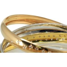 Embrace the celestial beauty and timeless elegance of the Cartier Trinity 18K Two Tone Celestial Tri Color Diamond Bangle Bracelet. This exquisite piece is more than just a bangle; it's a symbol of love and a testament to Cartier's craftsmanship. Created to commemorate Cartier's 100th Anniversary, this bangle is a true masterpiece.Crafted from 18K tri-color gold, this bracelet effortlessly blends white, yellow, and rose gold, symbolizing the unity of three cherished bonds. What sets this bangle Diamond Bangle Bracelet, Symbol Of Love, Diamond Bangles Bracelet, 100th Anniversary, Diamond Bangle, Colorful Bracelets, Love Symbols, Gold Bangles, Tri Color