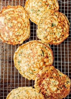 four fritter cakes cooling on a wire rack