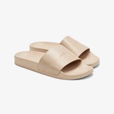 Named after a dreamy island off the coast of Tuscany, Koio’s Elba slide is a refined interpretation of the classic slide. The Elba is handcrafted with a Leather Working Group Silver-certified leather strap that’s embossed with a Koio logo and set on a comfortable PU sole. Beige Beach Slides With Rubber Sole, Classic Beach Slides With Cushioned Footbed, Classic Cushioned Slides For Beach, Classic Slide Sandals For The Beach, Classic Summer Slides For Vacation, Classic Slides For Summer Vacation, Classic Summer Vacation Slides, Classic Slip-on Beach Slides, Classic Beach Slides With Rubber Sole