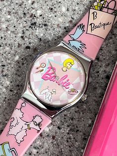 1994 Vintage Barbie Watch with Barbie Tin working condition with new battery, running well fun poodle, gloves, suitcase pink boutique design.  This is a plastic band watch, fun and colorful early Barbie Collectible from the early 90s.  The face is roughly 34mm. Glam Clothes, Barbie Luggage, Suitcase Pink, Barbie Backpack 90s, Barbie Birthstone Collection, Barbie Doll Carrying Case, Barbie Cases Vintage, Pink Boutique, Barbie Vintage