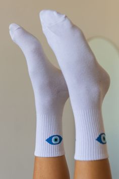 Look oh so cute in these comfy socks that are perfect worn with your fav sneakers and a cute mini for the ultra cool girl vibe. Color: White/Blue Evil Eye Design One Size Fits Most White Sporty Everyday Socks, Trendy White Socks For Streetwear, Trendy White Streetwear Socks, Casual White Socks, Everyday Sporty Cotton Socks, Playful White Cotton Socks, Sporty Cotton Socks For Everyday, Sporty Everyday Cotton Socks, Casual Summer Streetwear Socks