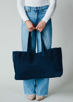 Blue, white and yellow mountain scene tote Navy "ROAD TRIP" textured text on the front Measures 11" x 20" x 6" 100% Cotton Lining: 100% Polyester Blue Canvas Bags For Weekend, Blue Canvas Weekend Bag, Blue Canvas Tote Bag For Weekend, Blue Tote Canvas Bag For The Weekend, Blue Cotton Canvas Bag For Weekend, Blue Tote Bag For Weekend, Blue Canvas Bag With Large Capacity For Weekend, Blue Large Capacity Canvas Bag For Weekend, Blue Rectangular Bag For Weekend