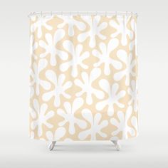 a shower curtain with an abstract design on the front and back side, in beige