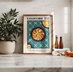 a kitchen counter with an art print on the wall above it and two bottles next to it