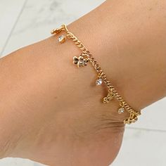 The bee charms, elegantly spaced along the anklet bracelet, add a touch of whimsy and nature's allure. The charm of these buzzing creatures is amplified by their symbolism, representing diligence, teamwork, and the importance of appreciating the small wonders in life. The bees' presence on the anklet bracelet creates a delightful and unique accessory that is meaningful and fashionable. PRODUCT DESCRIPTION Multicolor Cubic Zirconia Stone Anklet Material: -Gold Filled - Anklet Lenght: 10 inches - Charm Anklet, Gold Dangle Anklets As Gift, Gold Dangle Anklets For Gift, Elegant Gold Dangle Anklets, Crystal Anklet, Pretty Jewelry Necklaces, Gold Anklet, Bee Charms, Dope Jewelry