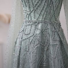 the back of a dress with beading on it