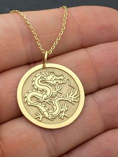 "14k Solid Gold Chinese Dragon Necklace, Personalized Chinese Dragon Pendant, Dragon Symbol Pendant, Chinese Mythology 14k Solid Gold Choose What Size You Want the Pendant Using The First Option Box Choose Chain Length Or Without Chain Using The Second Option Box Photos Are For The 25.4 mm / 1 Inch Diameter Pendant Pendant thickness : 0.7mm  Contact us if you want it thicker Inner diameter of jump ring : 5mm Contact us if you need it bigger  Chain width : 1.30mm     ♥ Material of pendant and chain: Solid Gold k14 ♥ Packaging: All of our jewelry are beautifully boxed and ready for gifting For more personalized designs take a look here: ♥ www.etsy.com/listing/736955132 ♥ www.etsy.com/listing/819494857 ♥ www.etsy.com/listing/823397880 ♥ www.etsy.com/listing/769847320 ♥ www.etsy.com/listing/87 Flower Necklace Outfit, Necklace Gold Indian, Choker Necklace Outfit, Gold Chinese Dragon, Small Diamond Necklace, Dragon Symbol, Small Gold Necklace, Red Flower Necklace, Dragon Chino