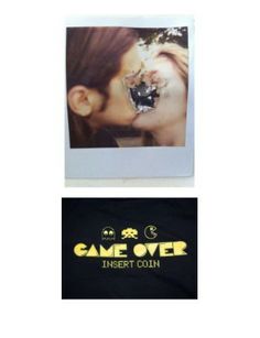 an image of a couple kissing in front of a t - shirt that says game over