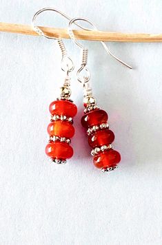 Carnelian Drop Earrings ☀️ These dainty Earrings have 6mm Carnelian Agate stones ...   the Earrings measure approximately 1.5 inches long... with Sterling Silver ear wires... ✨ Visit our Etsy Shop....  for Lapis, Abalone, Turquoise, Agate, Jasper, Onyx... and more... https://www.etsy.com/shop/CrystalHavenDesign 🌻 Carnelian Drop Earrings As Gift, Carnelian Drop Earrings For Gift, Red Carnelian Earrings, Nickel-free Red Carnelian Earrings, Red Carnelian Earrings With Ear Wire, Red Carnelian Earrings Perfect As A Gift, Red Carnelian Pierced Earrings, Red Stone Earrings, Carnelian Earrings