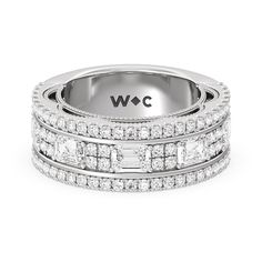 a white gold wedding band with three rows of diamonds on the inside and outside of it