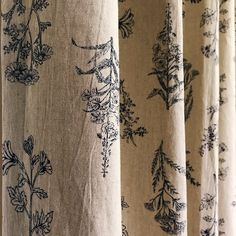 curtains with black and white floral designs on them